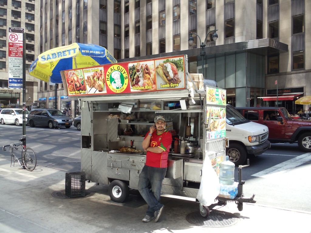 A hot dog cart on 54th Street in New York getting ready to open